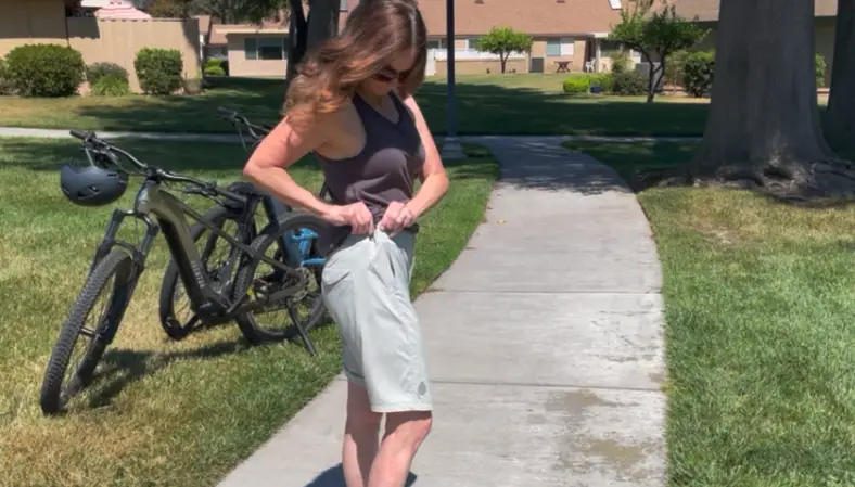 Lisa adjusting the waistband in the OPR short